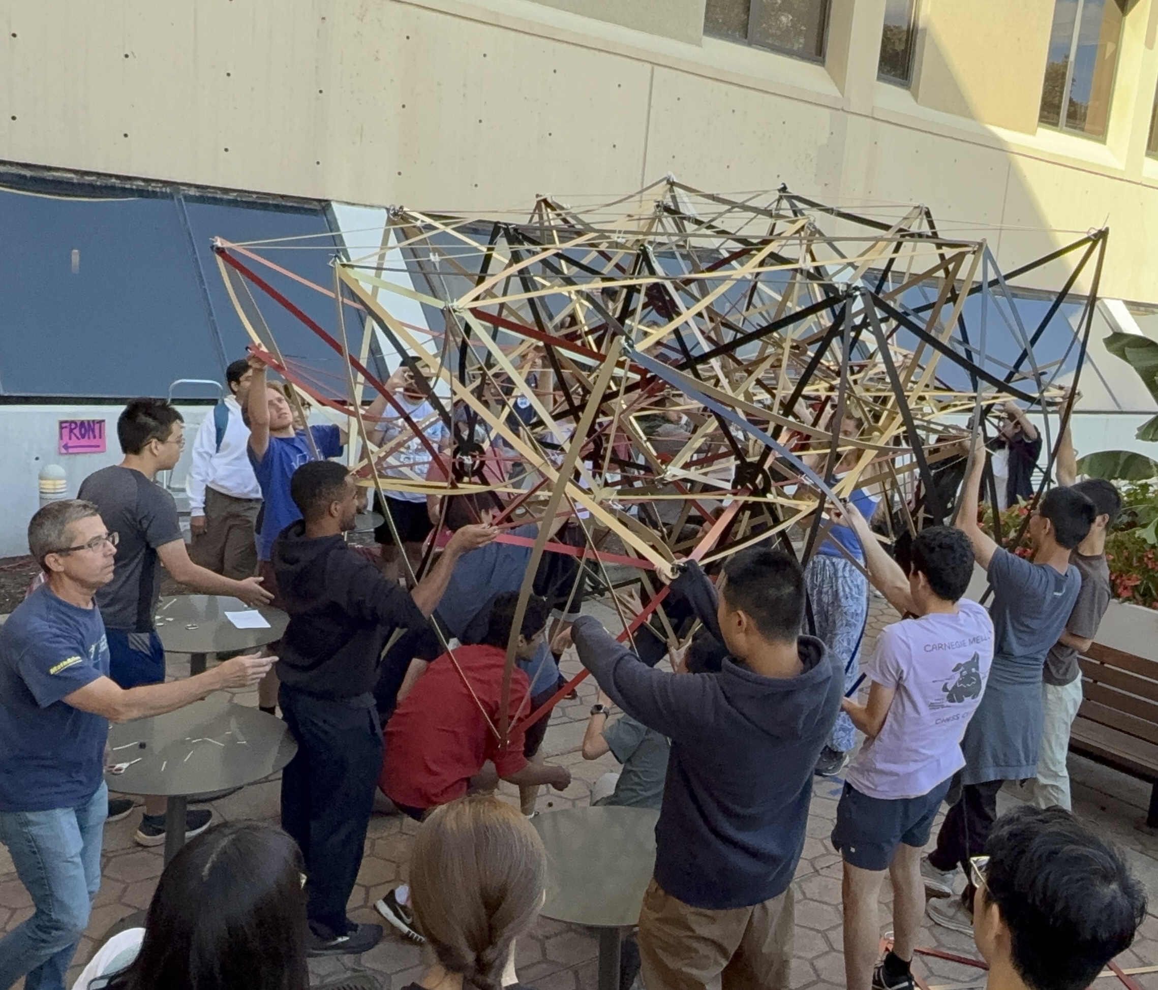 People building the sculpture